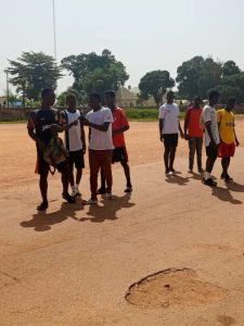 young footballers training on a grass field